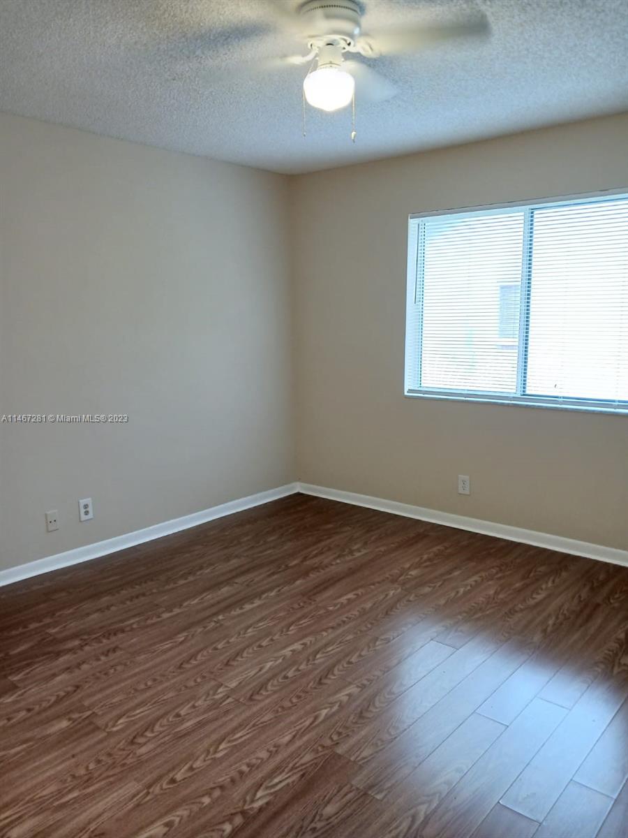 The Hammocks Miami, FL 33186 - Photo 11 of 17 a view of an empty room with wooden floor and a window