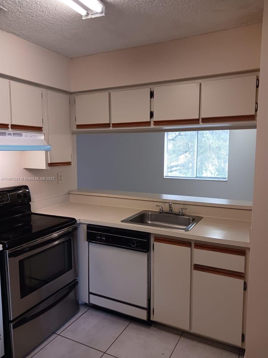 The Hammocks Miami, FL 33186 - Photo 12 of 17 a kitchen with cabinets appliances and a sink
