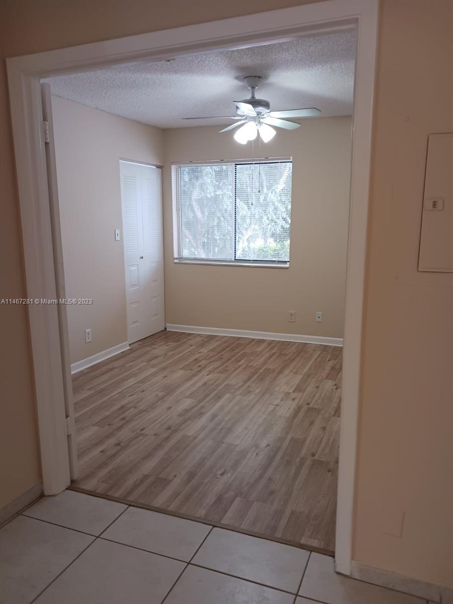 The Hammocks Miami, FL 33186 - Photo 6 of 17 an empty room with windows and chandelier fan