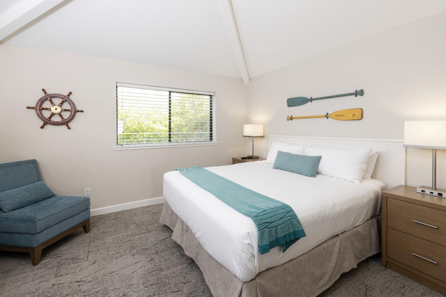 443 Seascape Resort Drive Aptos, CA 95003 - Photo 15 of 33 a bedroom with a bed and a couch