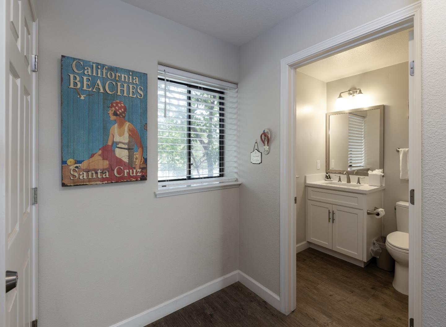 443 Seascape Resort Drive Aptos, CA 95003 - Photo 19 of 33 a bathroom with a toilet sink and mirror