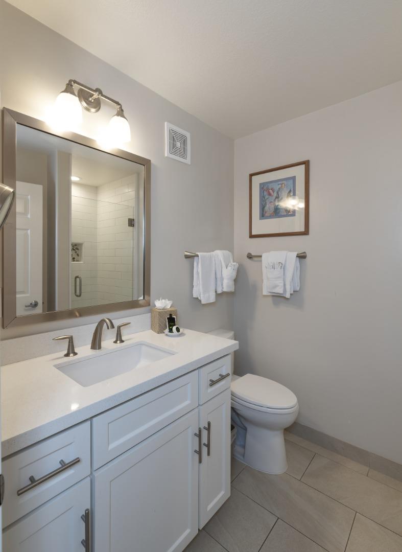 443 Seascape Resort Drive Aptos, CA 95003 - Photo 5 of 33 a bathroom with a toilet sink and mirror