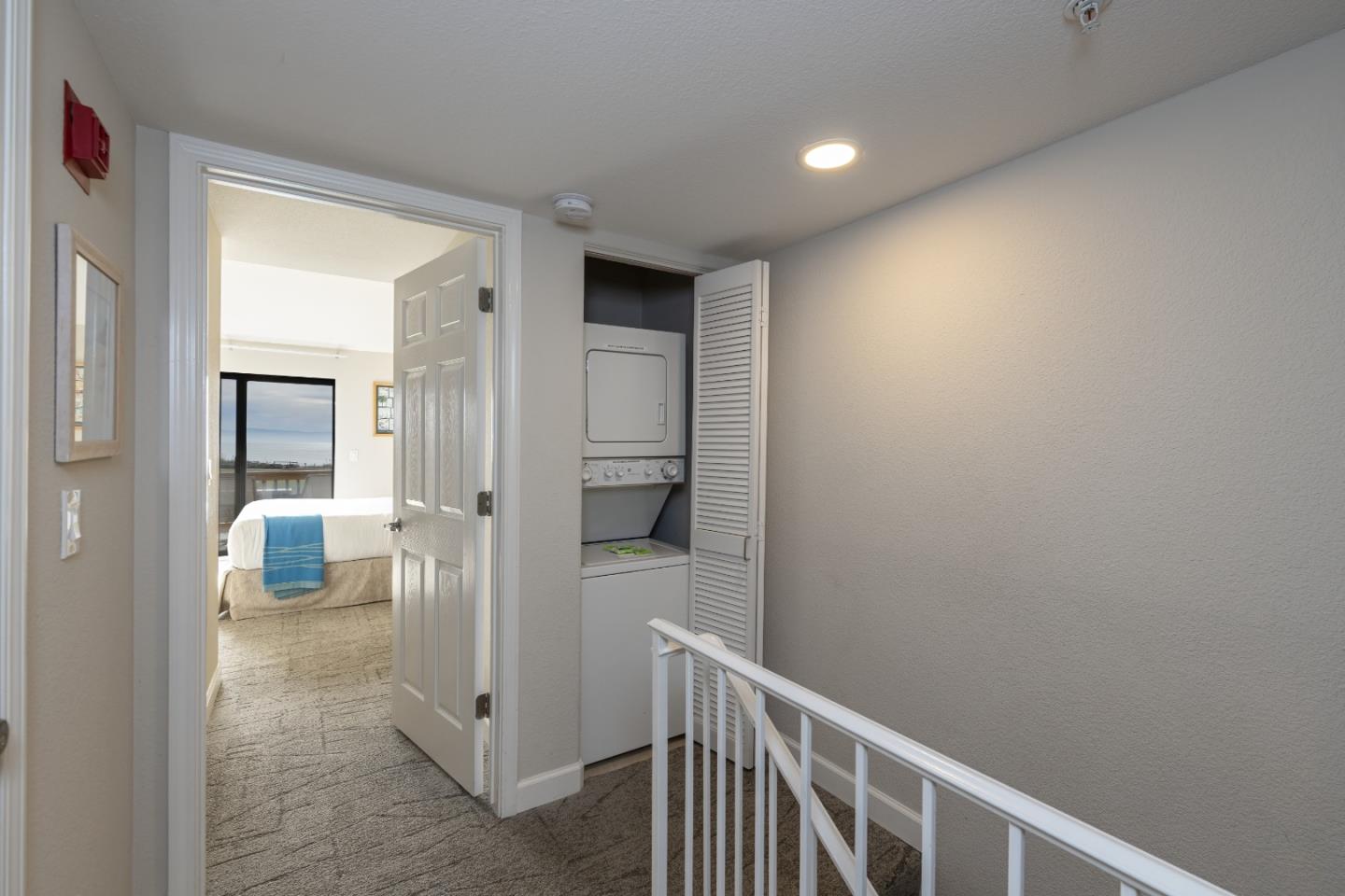 443 Seascape Resort Drive Aptos, CA 95003 - Photo 10 of 33 a view of a hallway with a livingroom and couch