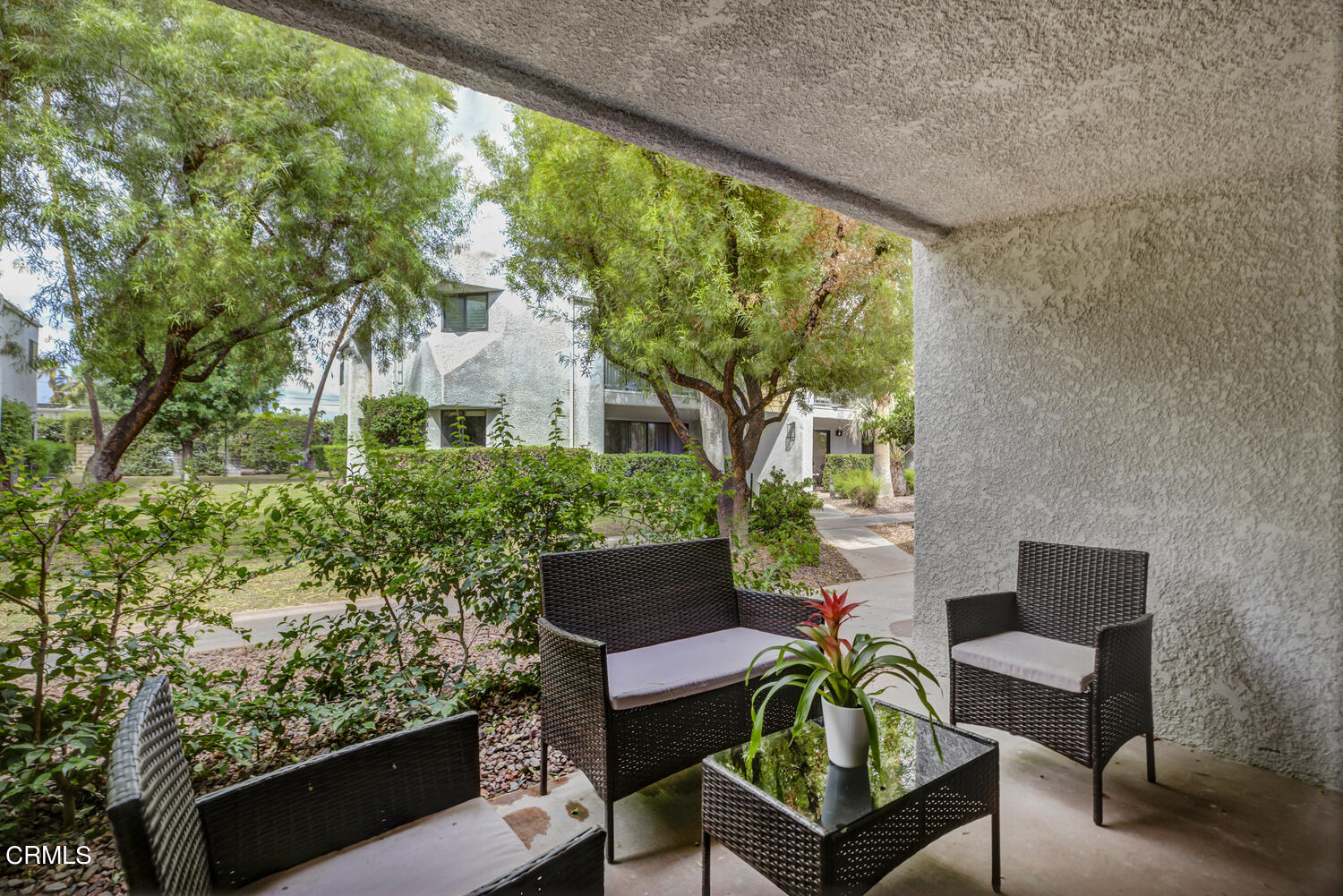 3155 Ramon Road, Unit 303 Palm Springs, CA 92264 - Photo 10 of 36 a outdoor living space with furniture and garden view