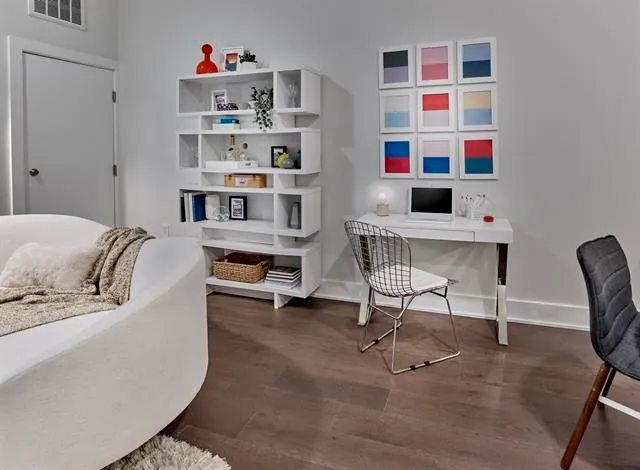 a living room with furniture cabinets and window