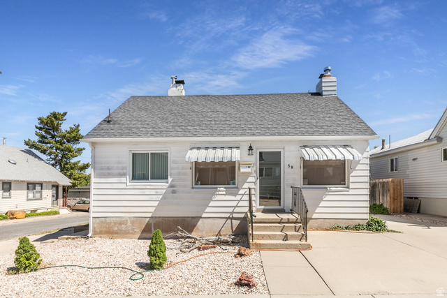 59 East Pinehurst Street Tooele, UT 84074 - Photo 2 of 22 Single-story residence featuring white siding and a gray shingle roof