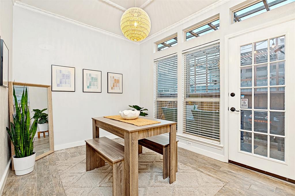3642 Word Street Dallas, TX 75204 - Photo 10 of 29 a view of a dining room with furniture and a window