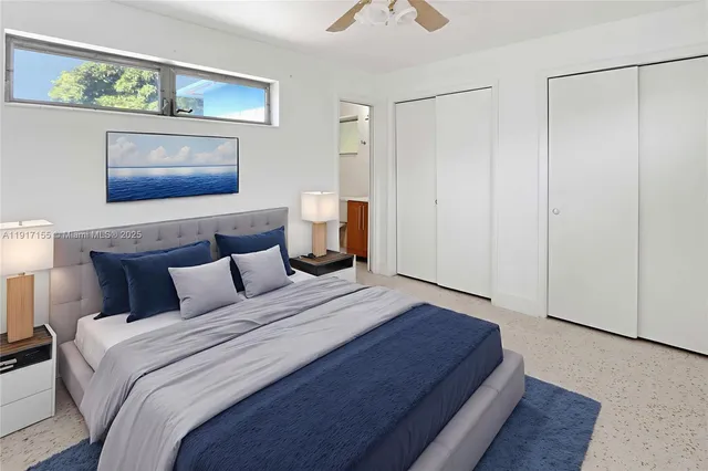 a bathroom with a toilet a sink and a window