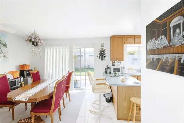 a view of a dining room with furniture and a large window