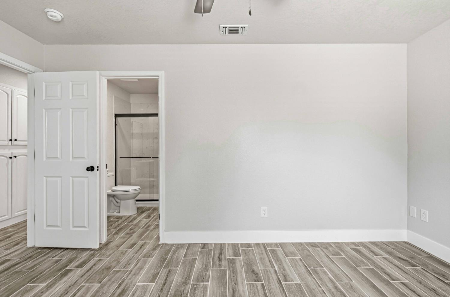 1464 Denise Drive Ripon, CA 95366 - Photo 26 of 41 a view of a room with wooden floor and bathroom