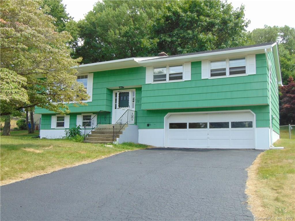77 Ardsley Road Waterbury, CT 06708 - Photo 1 of 1 a view of a house with a yard and sitting area
