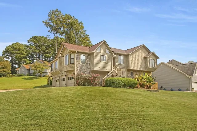 a front view of a house with a yard