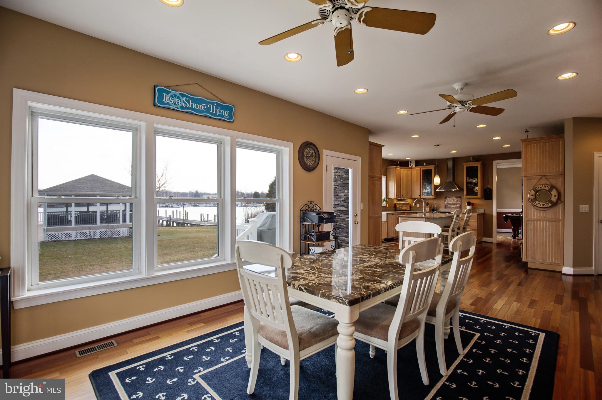 1457 Nieman Road Shady Side, MD 20764 - Photo 12 of 49 a view of a dining room with furniture window and wooden floor