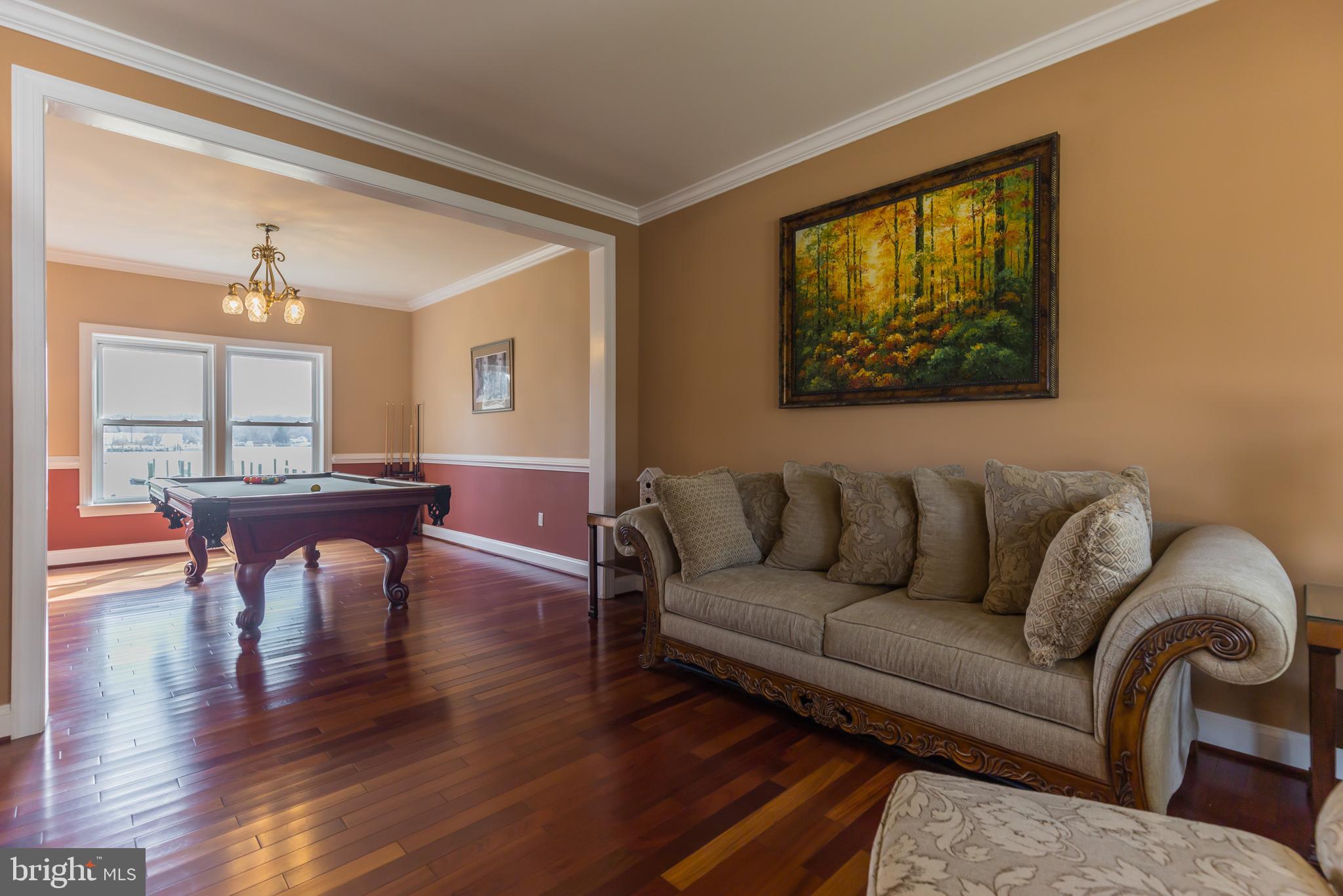 1457 Nieman Road Shady Side, MD 20764 - Photo 16 of 49 a living room with furniture and a table