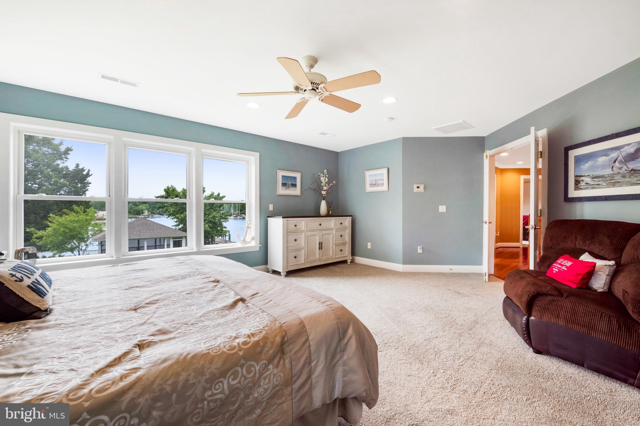 1457 Nieman Road Shady Side, MD 20764 - Photo 22 of 49 a spacious bedroom with a bed and a large window