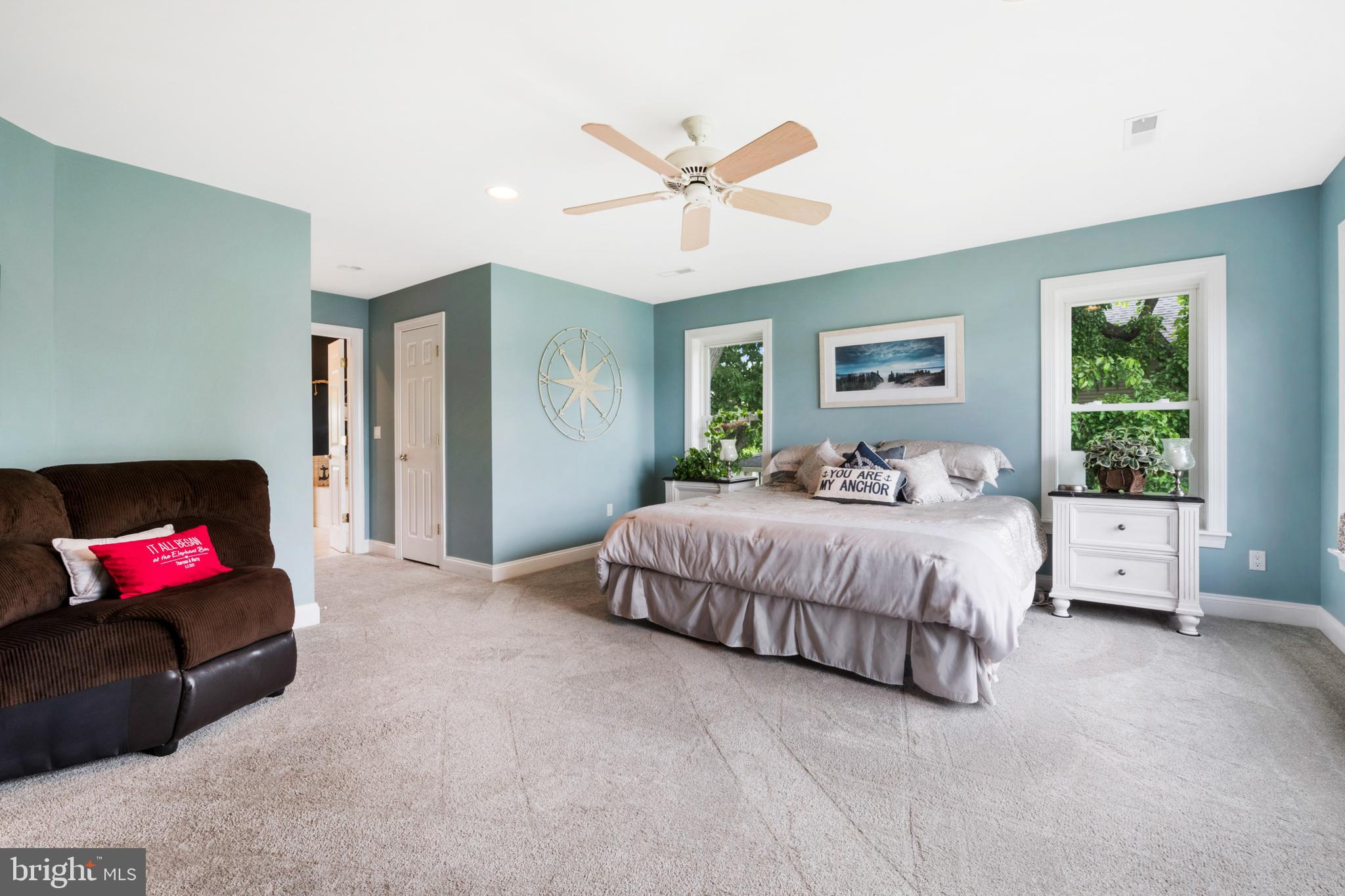 1457 Nieman Road Shady Side, MD 20764 - Photo 24 of 49 a spacious bedroom with a bed and a chandelier