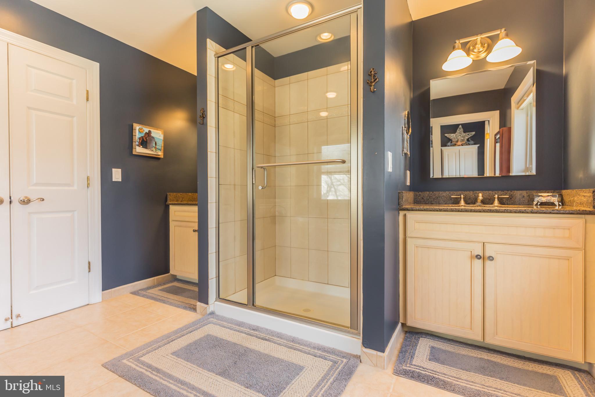 1457 Nieman Road Shady Side, MD 20764 - Photo 26 of 49 a bathroom with a shower and a mirror