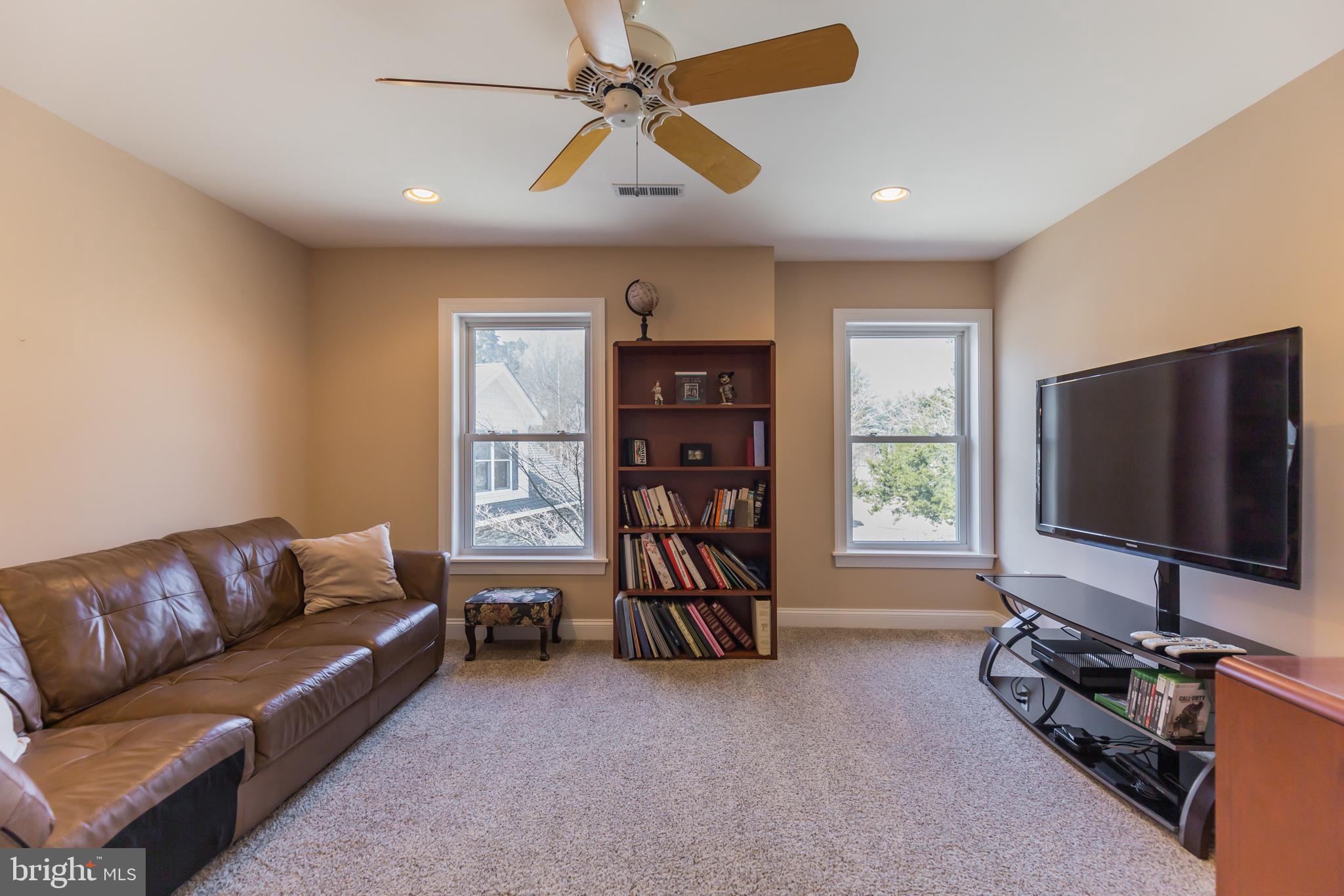 1457 Nieman Road Shady Side, MD 20764 - Photo 27 of 49 a living room with furniture and a flat screen tv