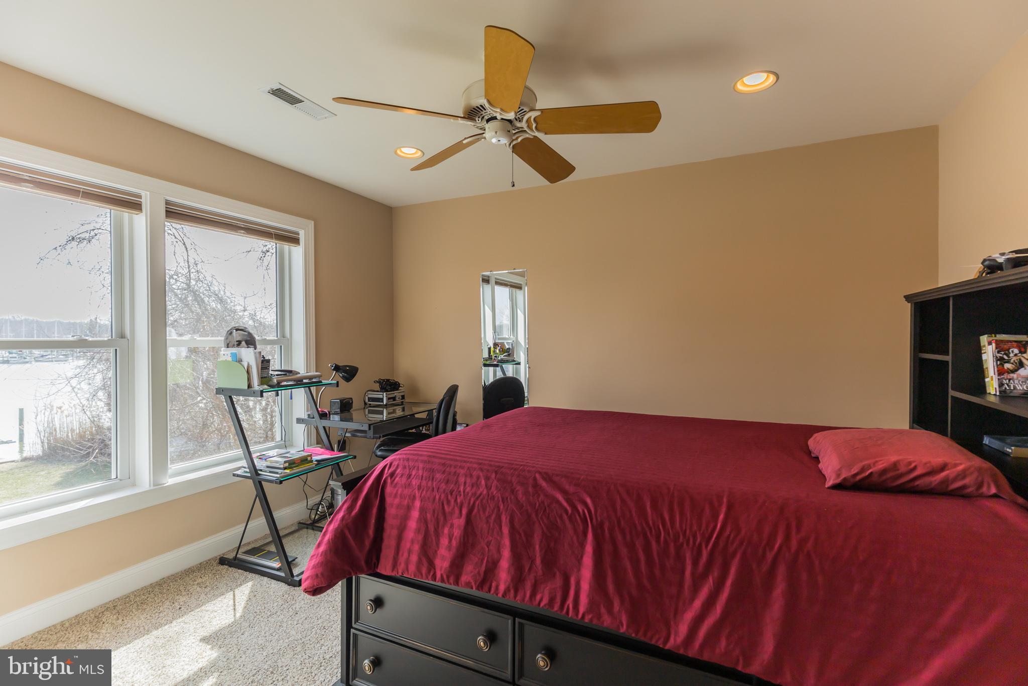 1457 Nieman Road Shady Side, MD 20764 - Photo 29 of 49 a bed sitting in a bedroom next to a window