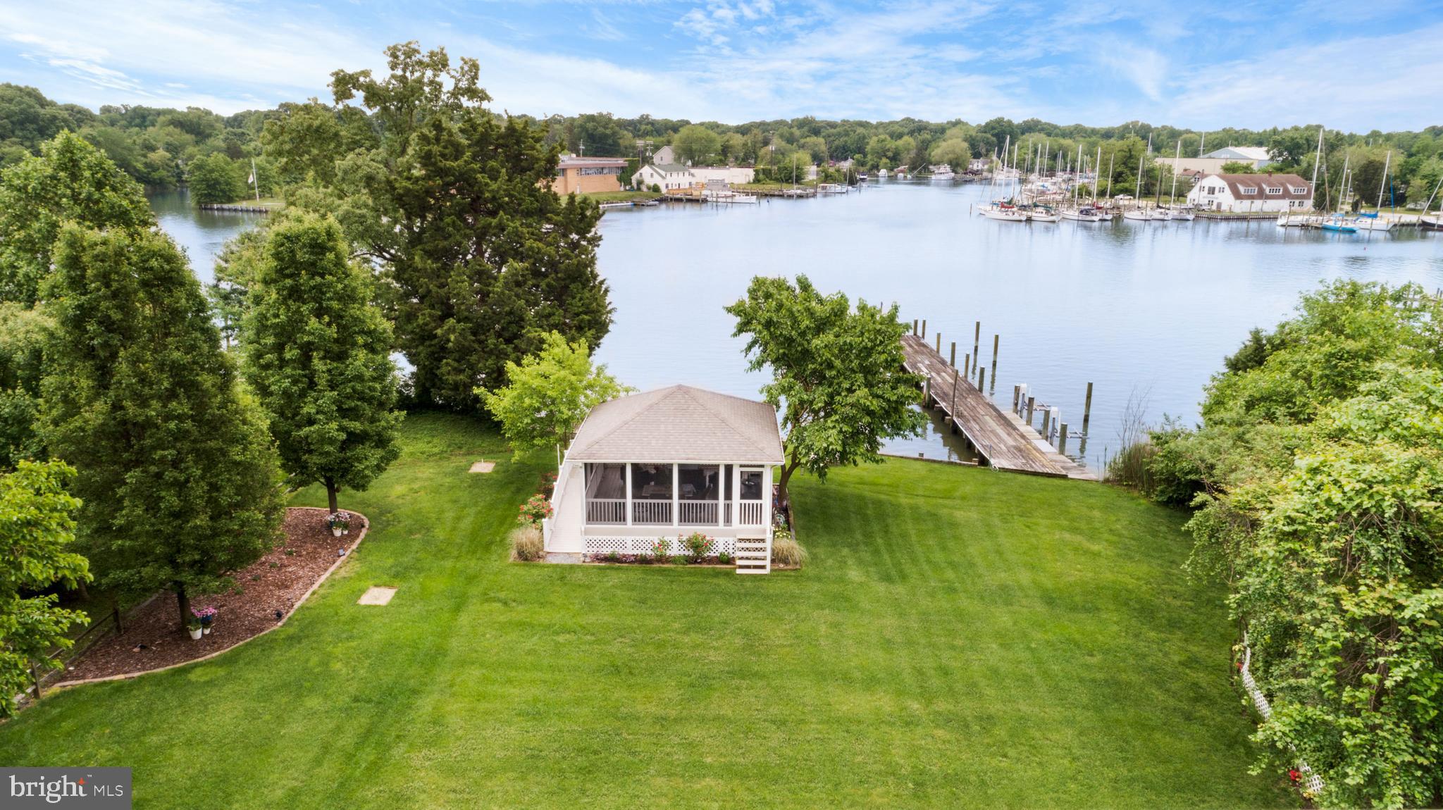 1457 Nieman Road Shady Side, MD 20764 - Photo 3 of 49 an aerial view of a house with a yard and lake view