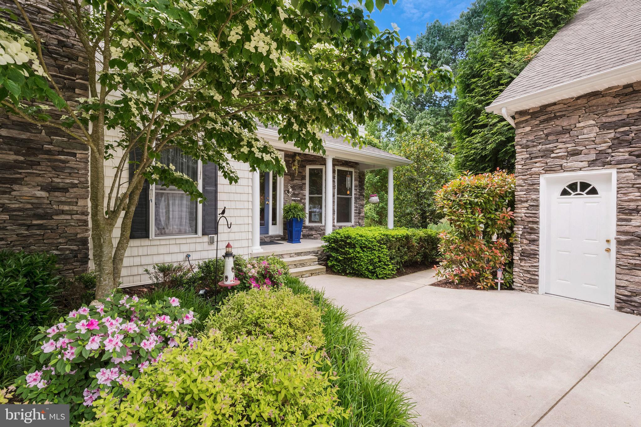 1457 Nieman Road Shady Side, MD 20764 - Photo 35 of 49 a view of a house with potted plants and large trees