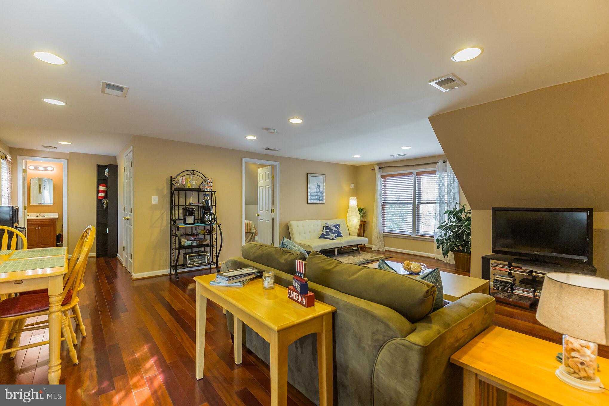 1457 Nieman Road Shady Side, MD 20764 - Photo 36 of 49 a living room with furniture and a flat screen tv