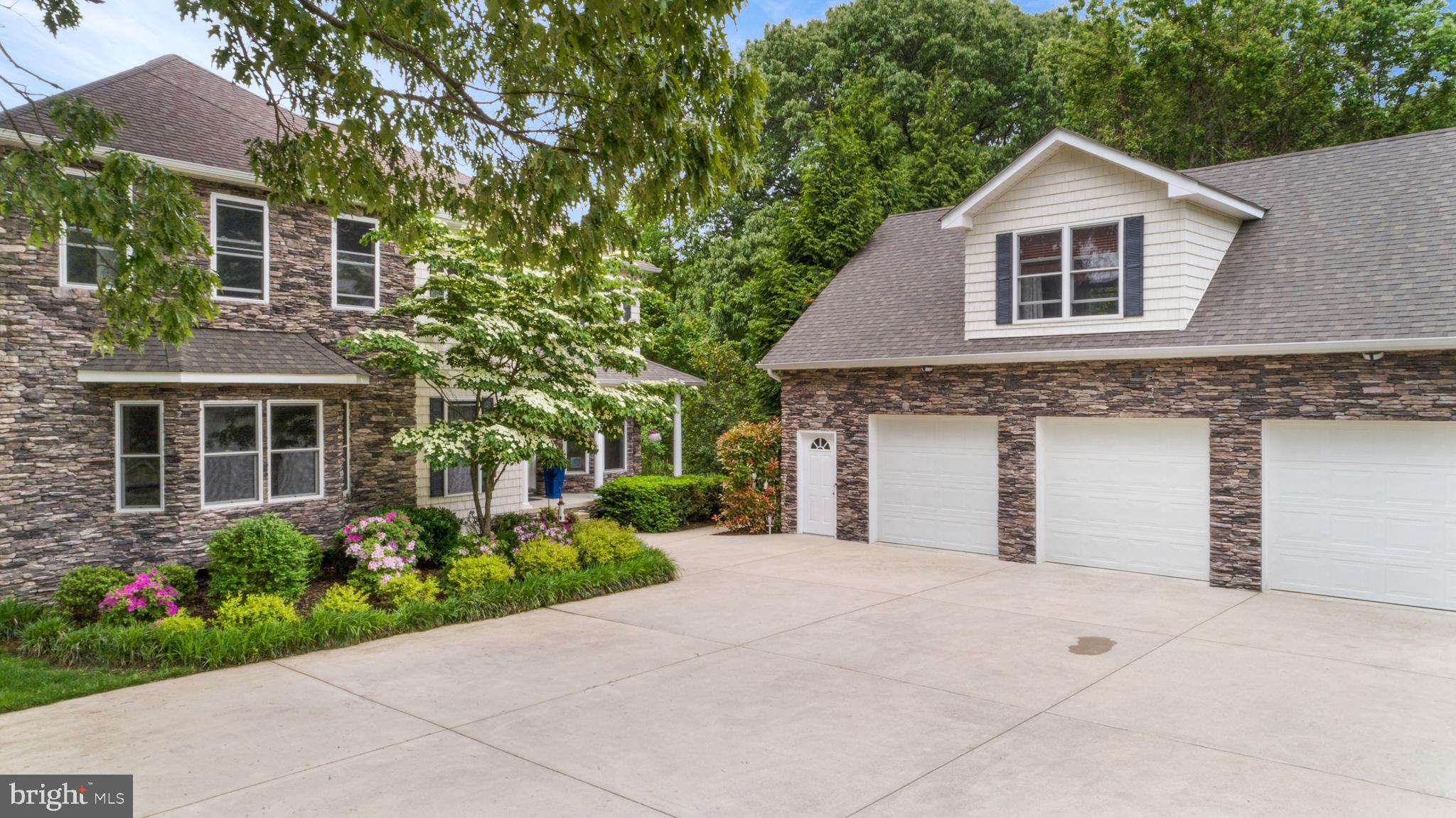 1457 Nieman Road Shady Side, MD 20764 - Photo 5 of 49 a front view of a house with a yard and garage