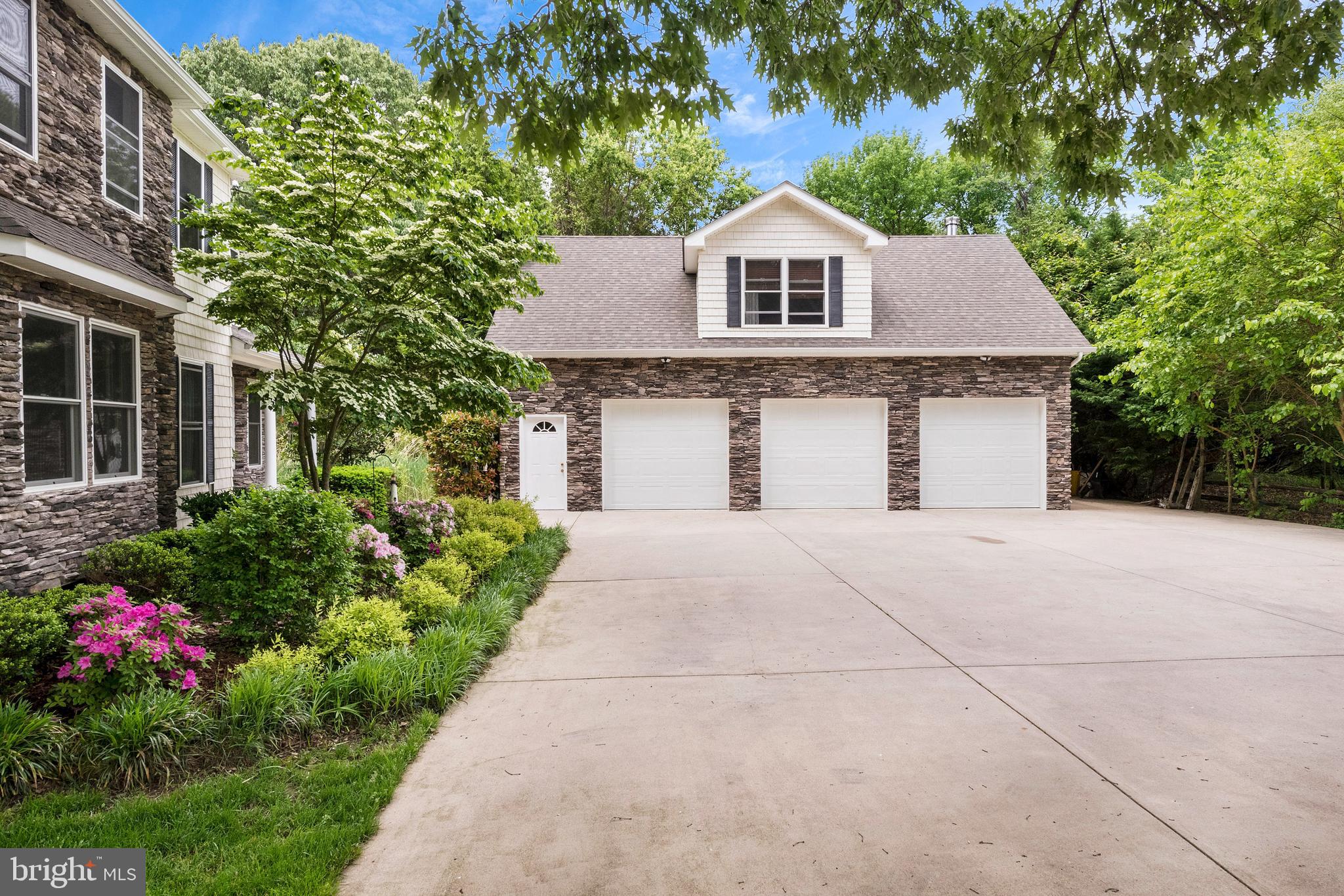 1457 Nieman Road Shady Side, MD 20764 - Photo 6 of 49 a front view of a house with a yard and garage