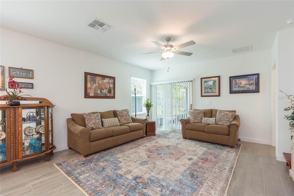 10806 Gable Dig Loop San Antonio, FL 33576 - Photo 10 of 73 a living room with furniture and a window