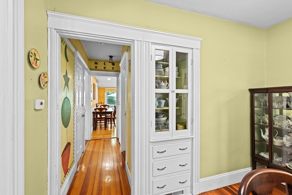 21 Fairview Road Needham, MA 02492 - Photo 8 of 28 a view of a hallway with wooden floor and windows