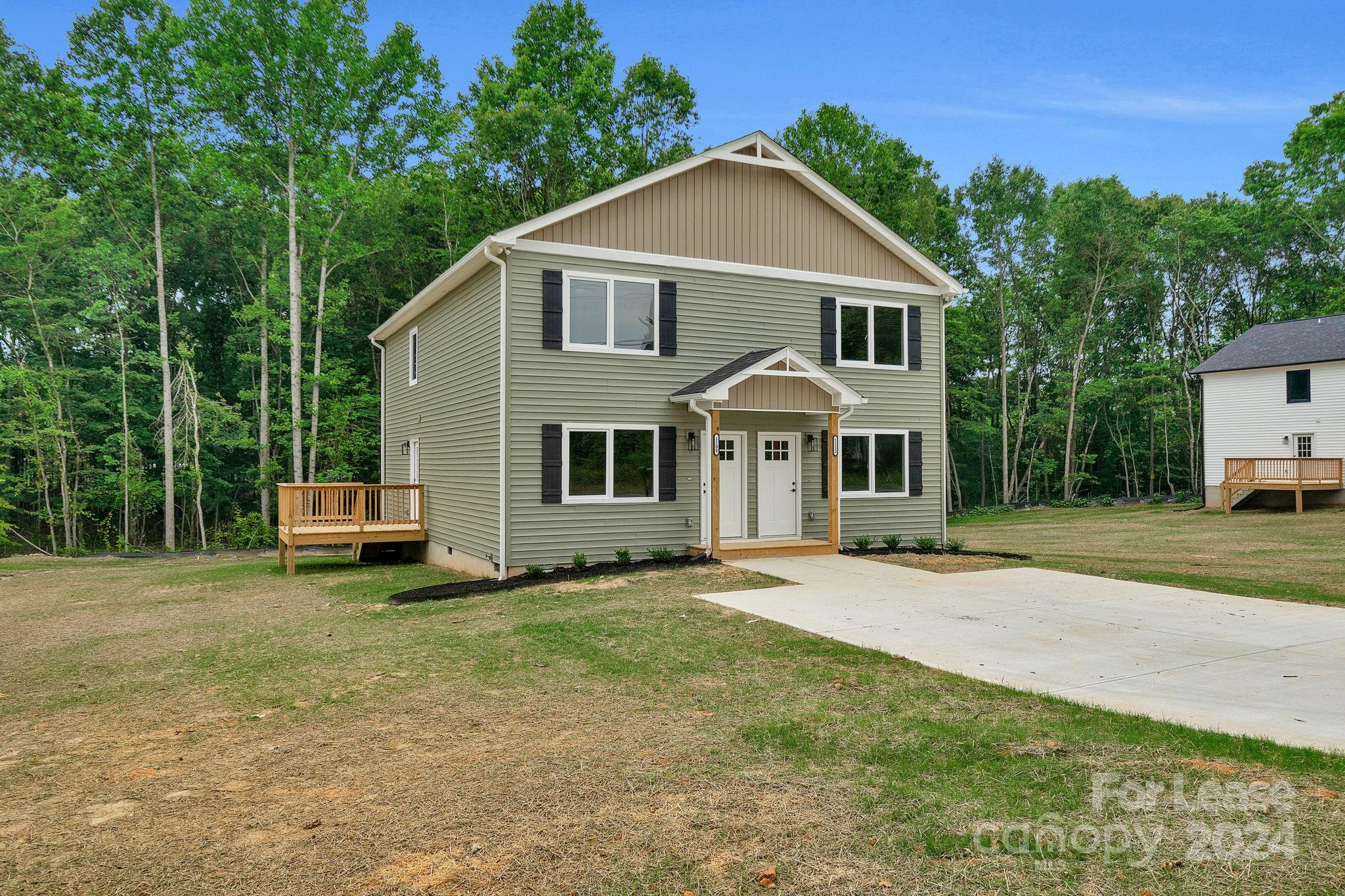 1112 Petes Road Lincolnton, NC 28092 - Photo 1 of 21 a front view of a house with a garden