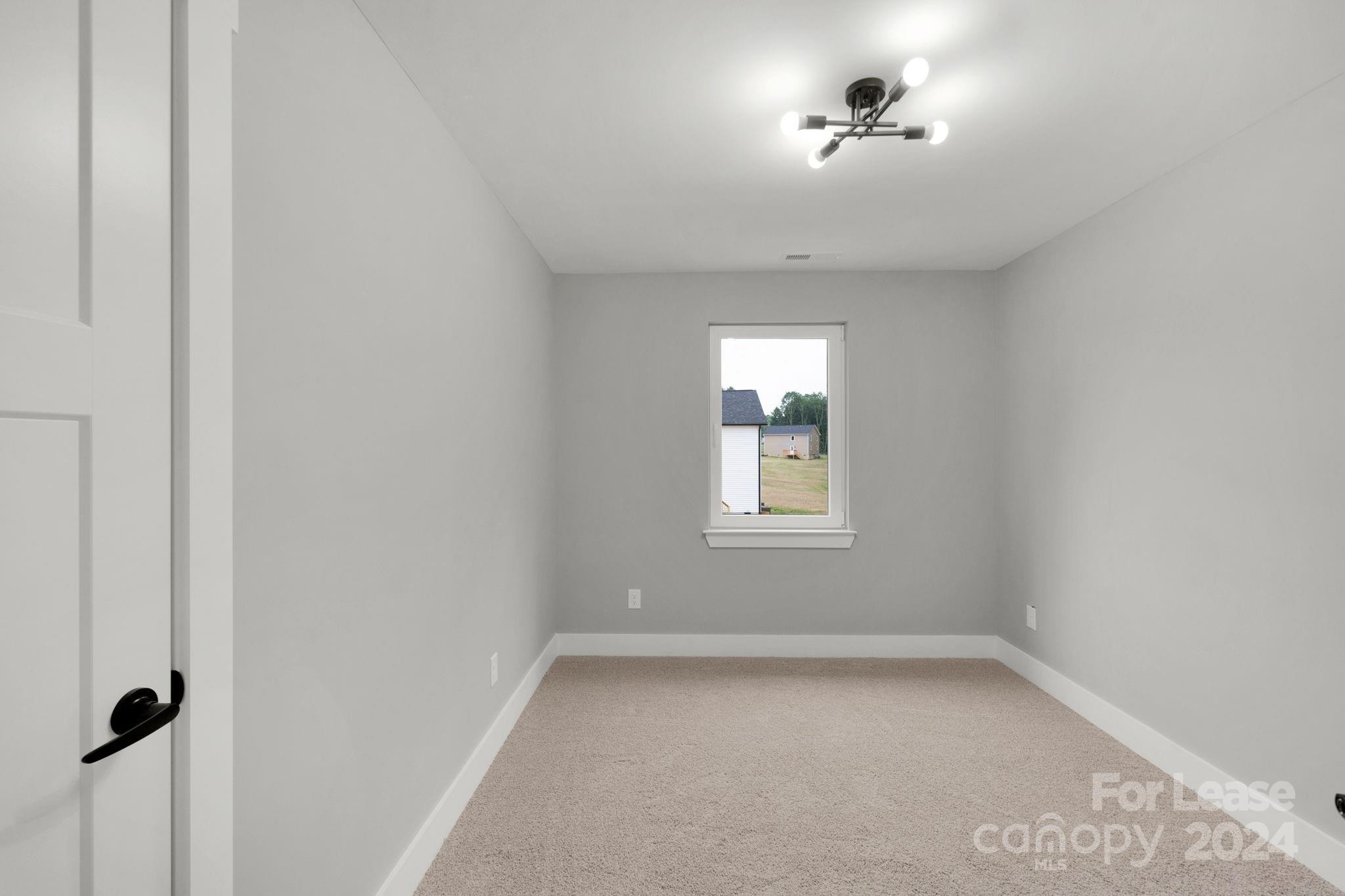 1112 Petes Road Lincolnton, NC 28092 - Photo 16 of 21 an empty room with a window