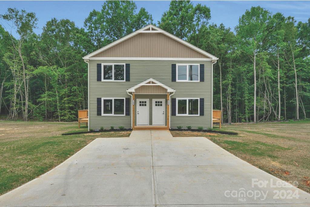 1112 Petes Road Lincolnton, NC 28092 - Photo 2 of 21 a front view of a house with a yard and trees