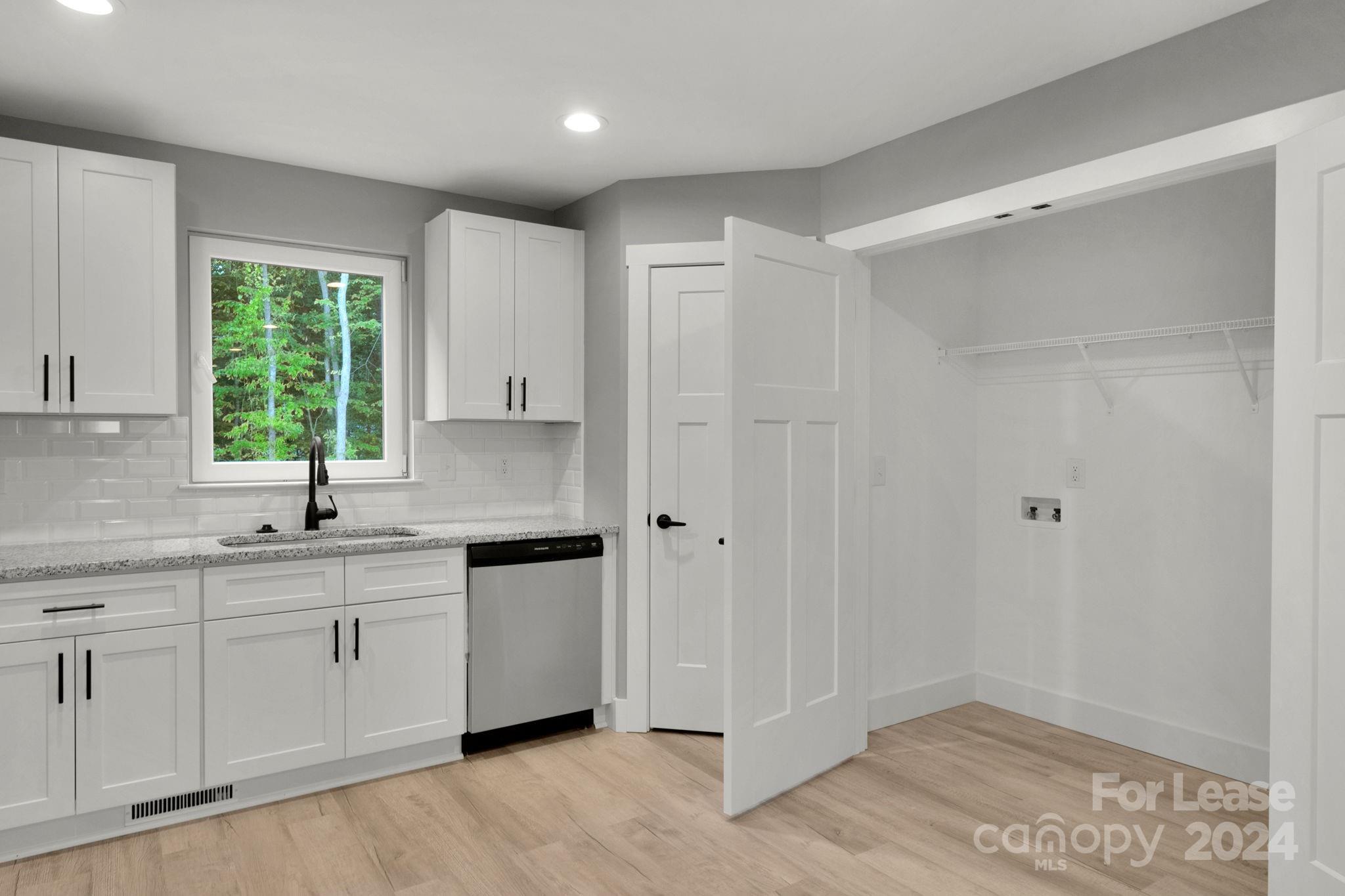 1112 Petes Road Lincolnton, NC 28092 - Photo 5 of 21 a kitchen with a sink and cabinets