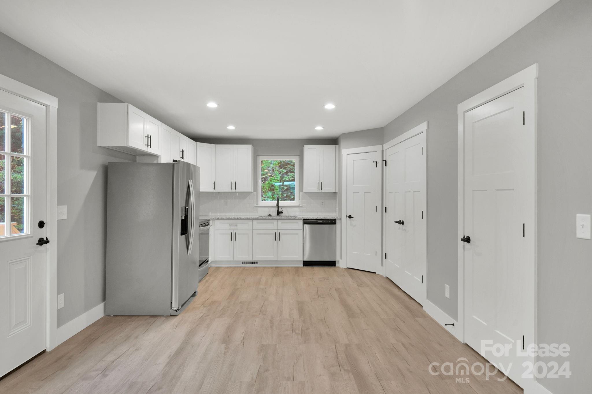 1112 Petes Road Lincolnton, NC 28092 - Photo 6 of 21 a kitchen with a refrigerator and a sink