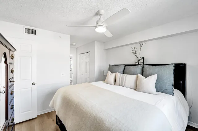 a bedroom with a bed and a walk in closet