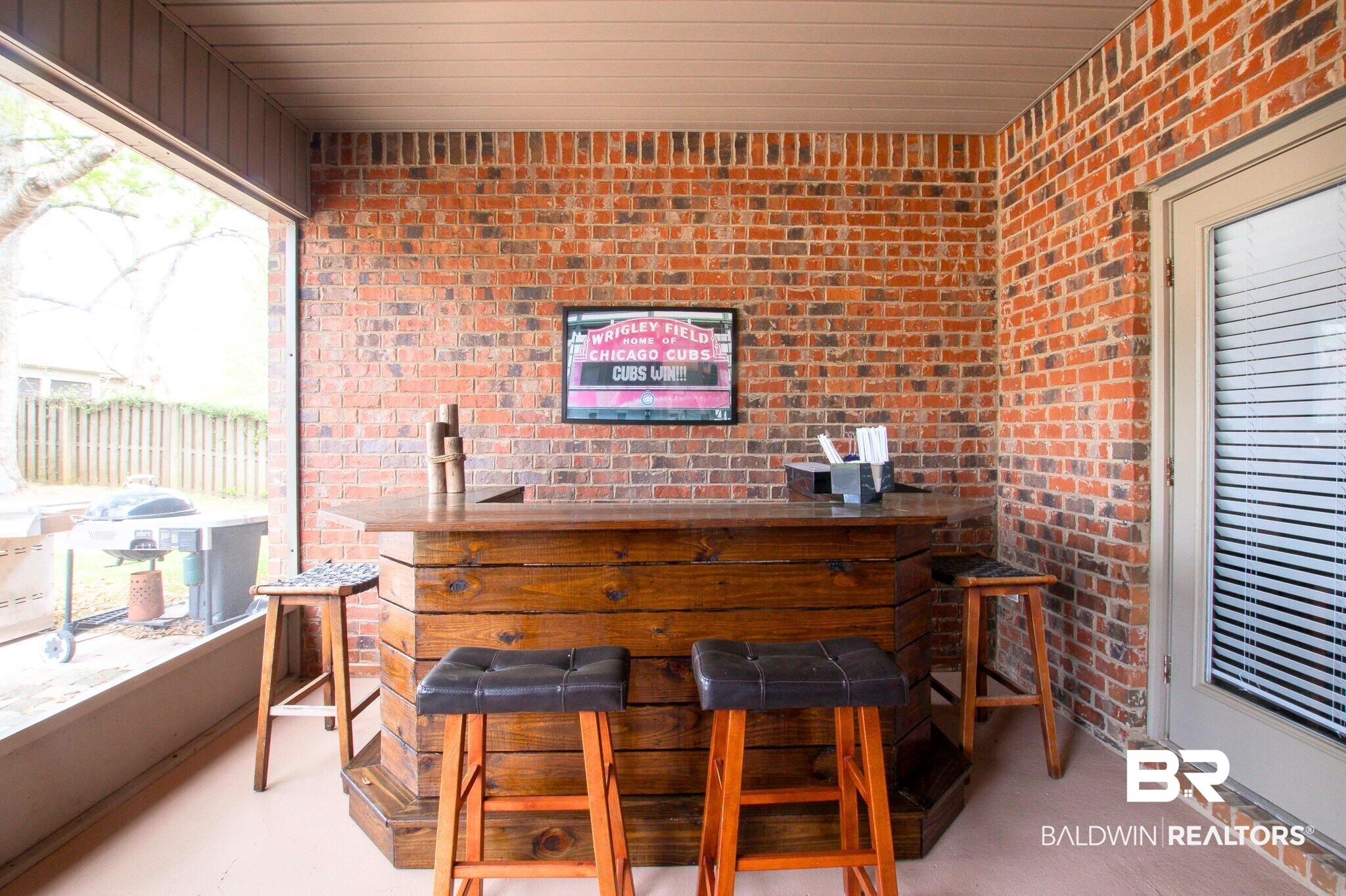 21439 Brick Stack Lane Fairhope, AL 36532 - Photo 27 of 32 Bar with a bar and brick wall