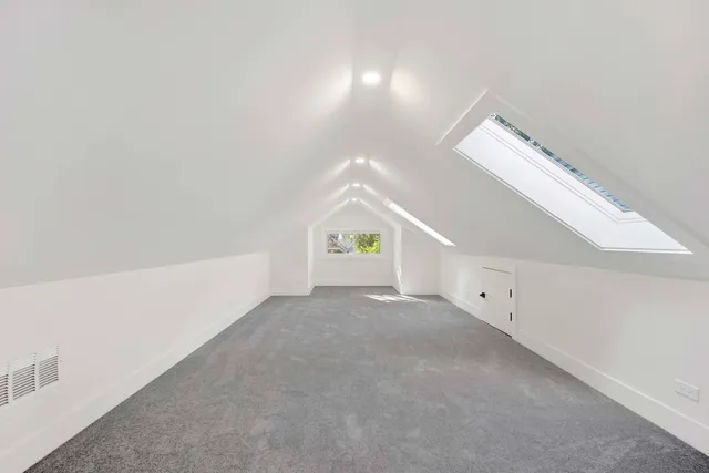 a view of an empty room with windows