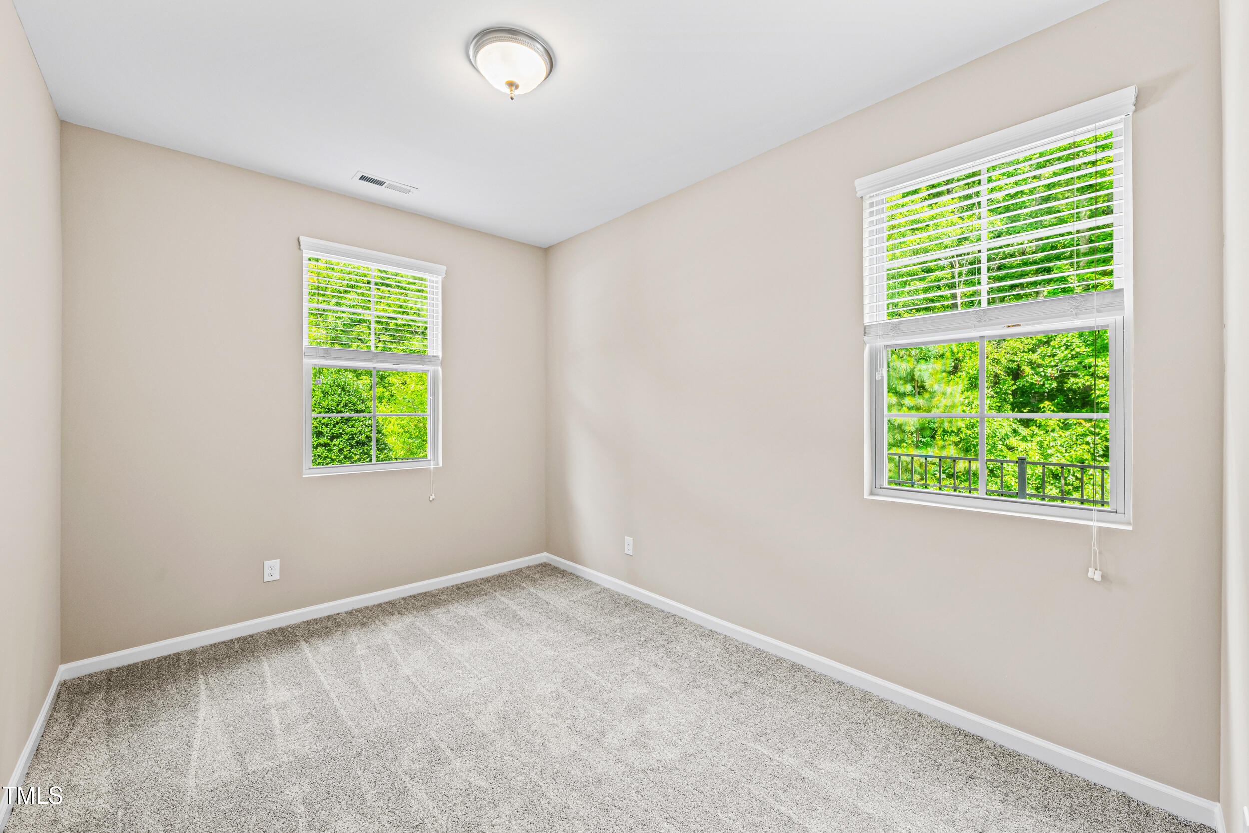 677 Wickham Ridge Road Apex, NC 27539 - Photo 17 of 34 an empty room with a window