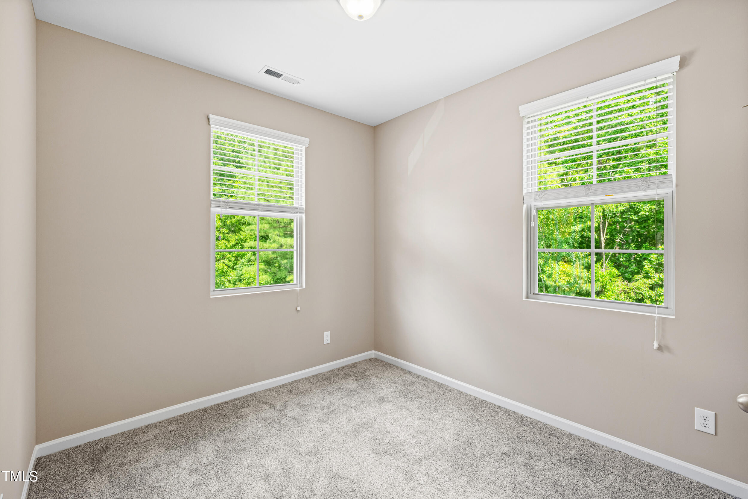 677 Wickham Ridge Road Apex, NC 27539 - Photo 29 of 34 an empty room with a window