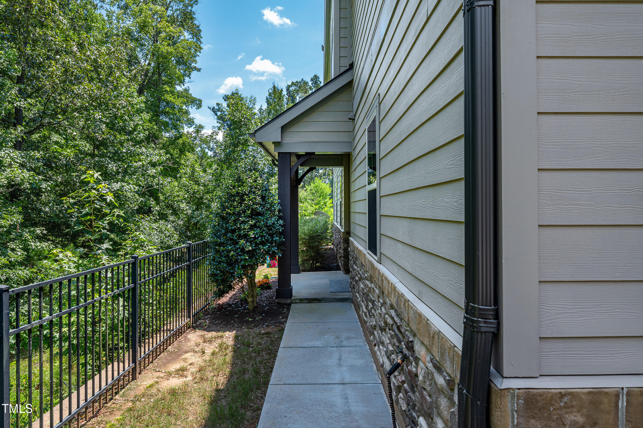 677 Wickham Ridge Road Apex, NC 27539 - Photo 3 of 34 a house view with a backyard