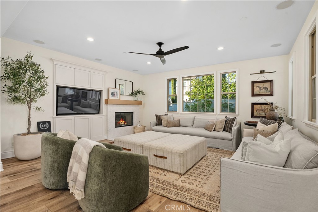 32 Michael Ladera Ranch, CA 92694 - Photo 11 of 44 a living room with furniture a flat screen tv and a fireplace