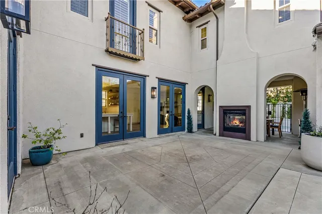 a view of roof deck with a barbeque and wooden stairs