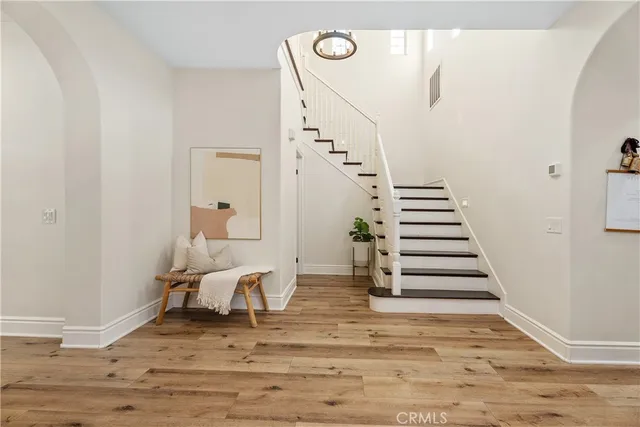 a view of hallway with livingroom and furniture