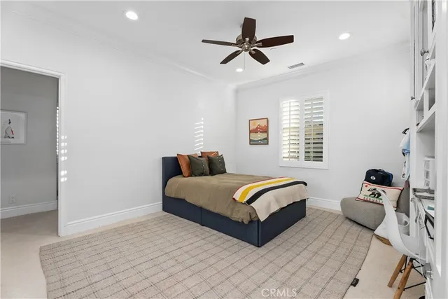 a bedroom with bed and a window