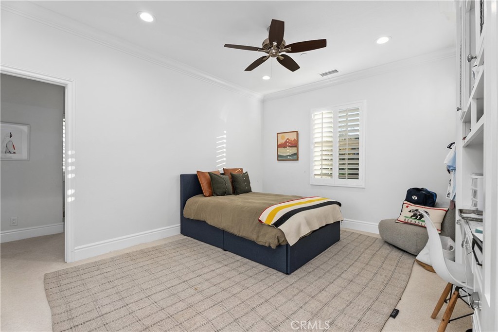 32 Michael Ladera Ranch, CA 92694 - Photo 30 of 44 a spacious bedroom with a bed a couch and a window