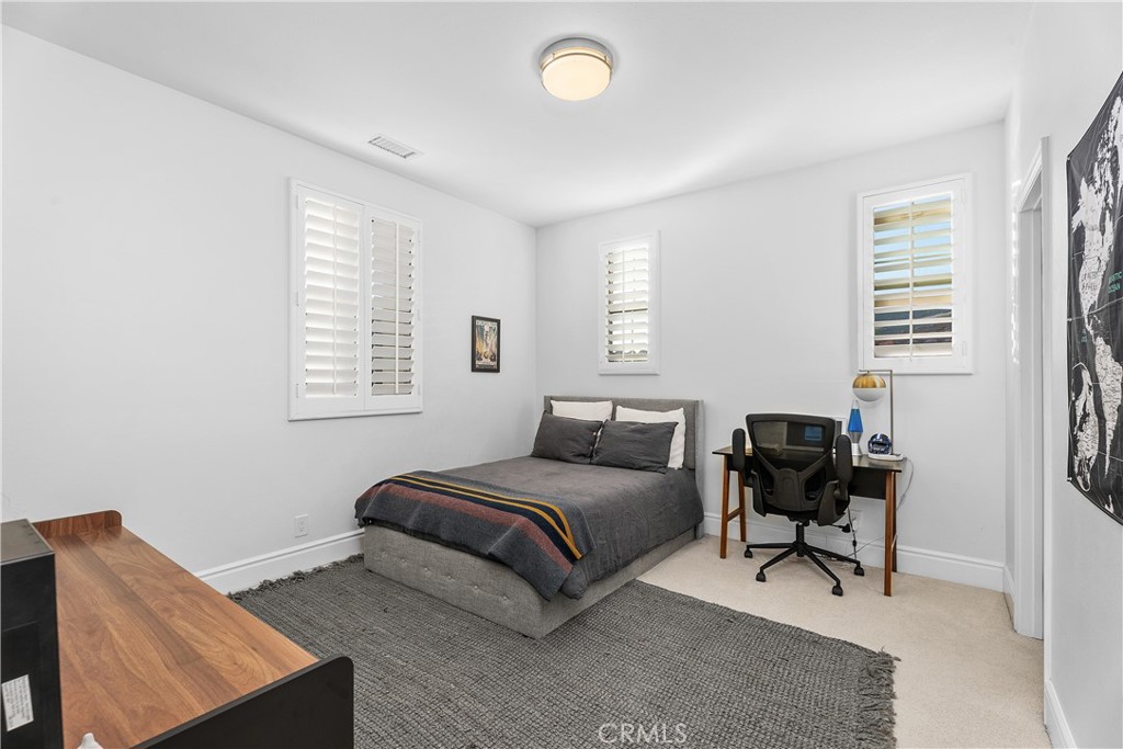 32 Michael Ladera Ranch, CA 92694 - Photo 32 of 44 a bedroom with a bed and a window