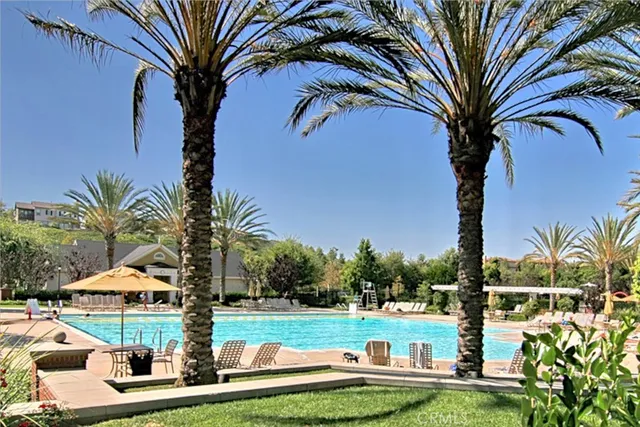 a view of outdoor space swimming pool and lounge chair