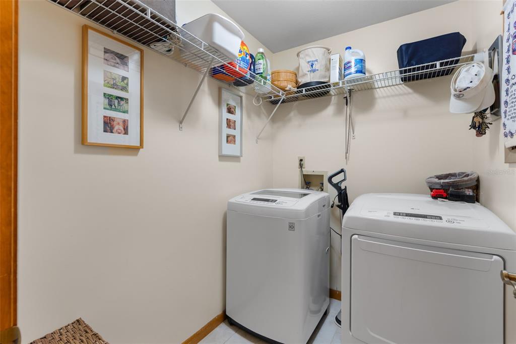 14334 Raintree Boulevard Grand Island, FL 32735 - Photo 30 of 40 a utility room with dryer and washer