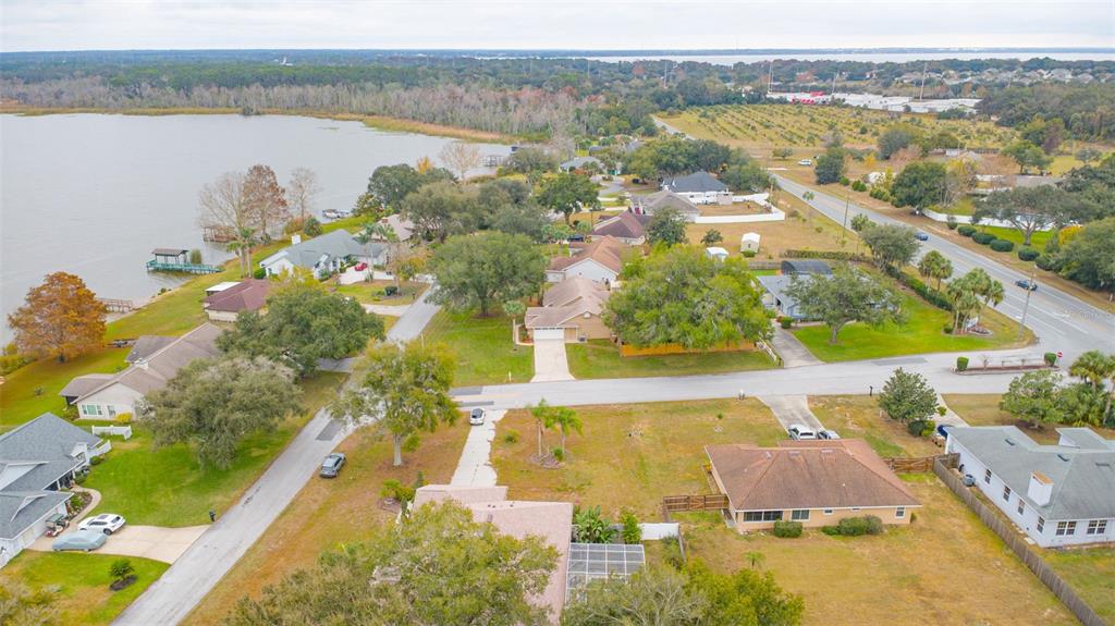 14334 Raintree Boulevard Grand Island, FL 32735 - Photo 38 of 40 an aerial view of residential houses with outdoor space and lake view